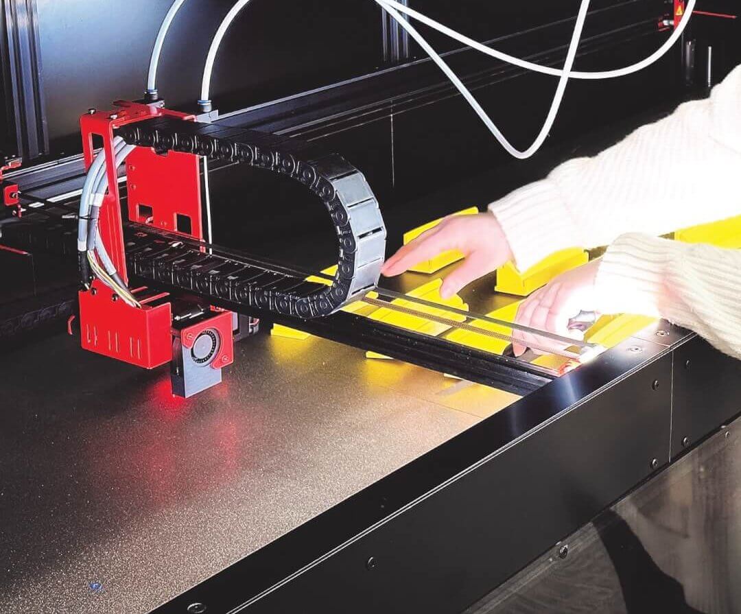 Courtney removing prints from large 3D printer
