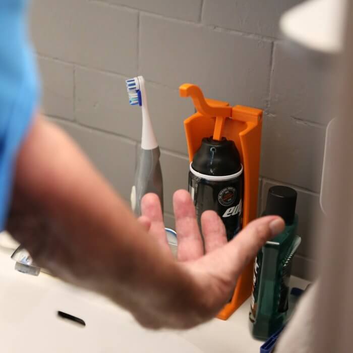 Client using Shaving cream dispenser