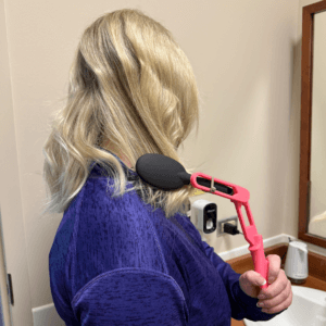 Woman using Adjustable Hairbrush